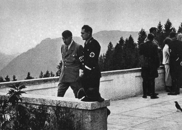 Adolf Hitler in conversation with Rudolf Hess on the terrace of Haus Wachenfeld, with Jakob Werlin in the background